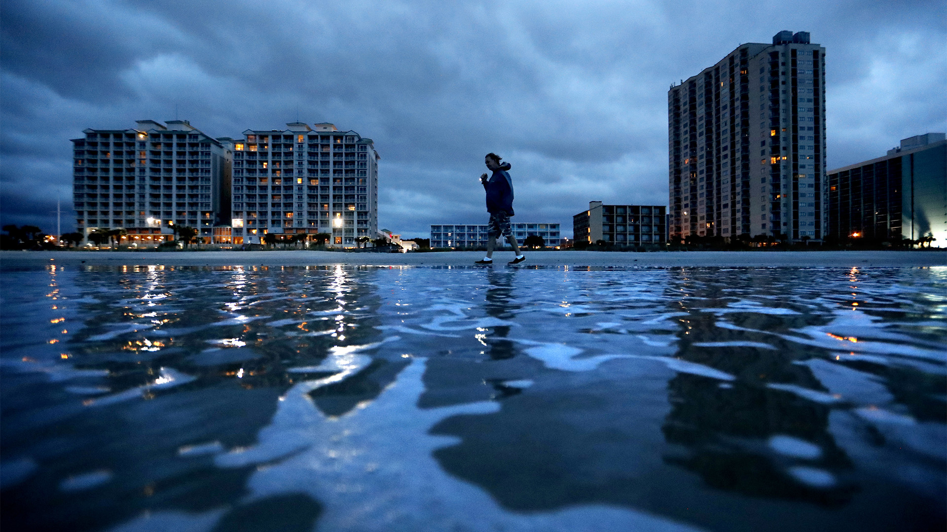 Russ Lewis looks for shells along the beach as Hurricane Florence approaches Myrtle Beach, S.C., Friday, Sept. 14, 2018. “We might get lucky we might not we’ll find out,” said Lewis of the storm. (AP Photo/David Goldman)